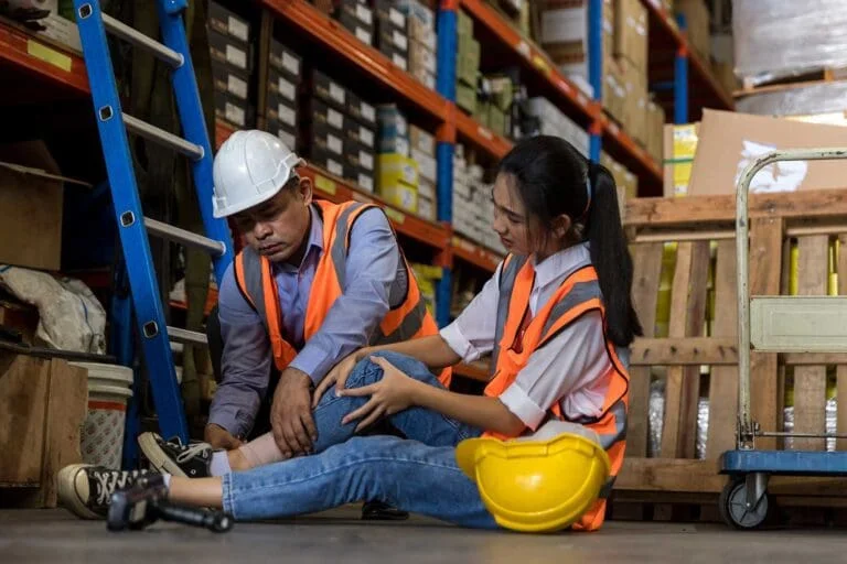 First aid support accident at work of worker in store room